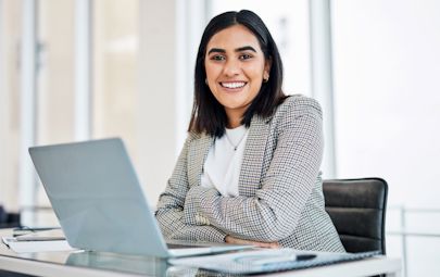 woman sitting at desk woman sitting at desk