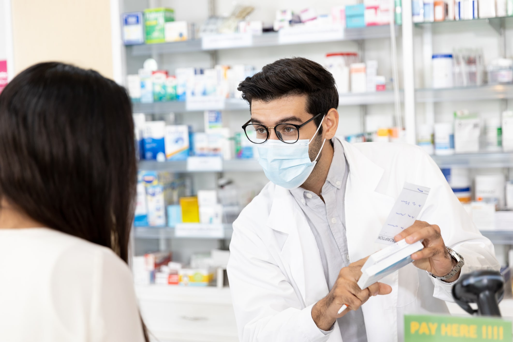 Pharmacist speaking with patient Pharmacist speaking with patient