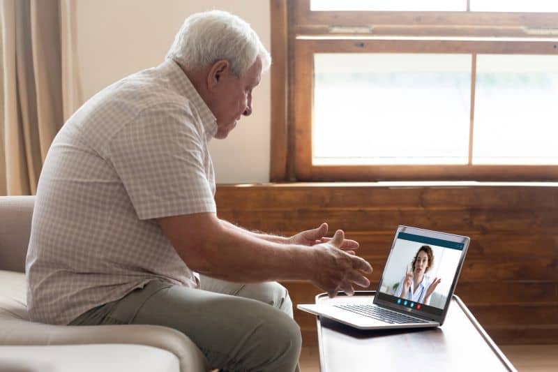 Elderly man have video call with doctor at home Elderly man have video call with doctor at home