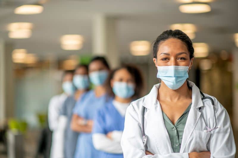 a group of male and female doctors a group of male and female doctors