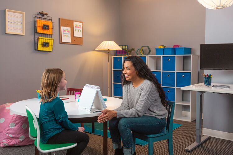 speech language pathologist working with school-aged child speech language pathologist working with school-aged child
