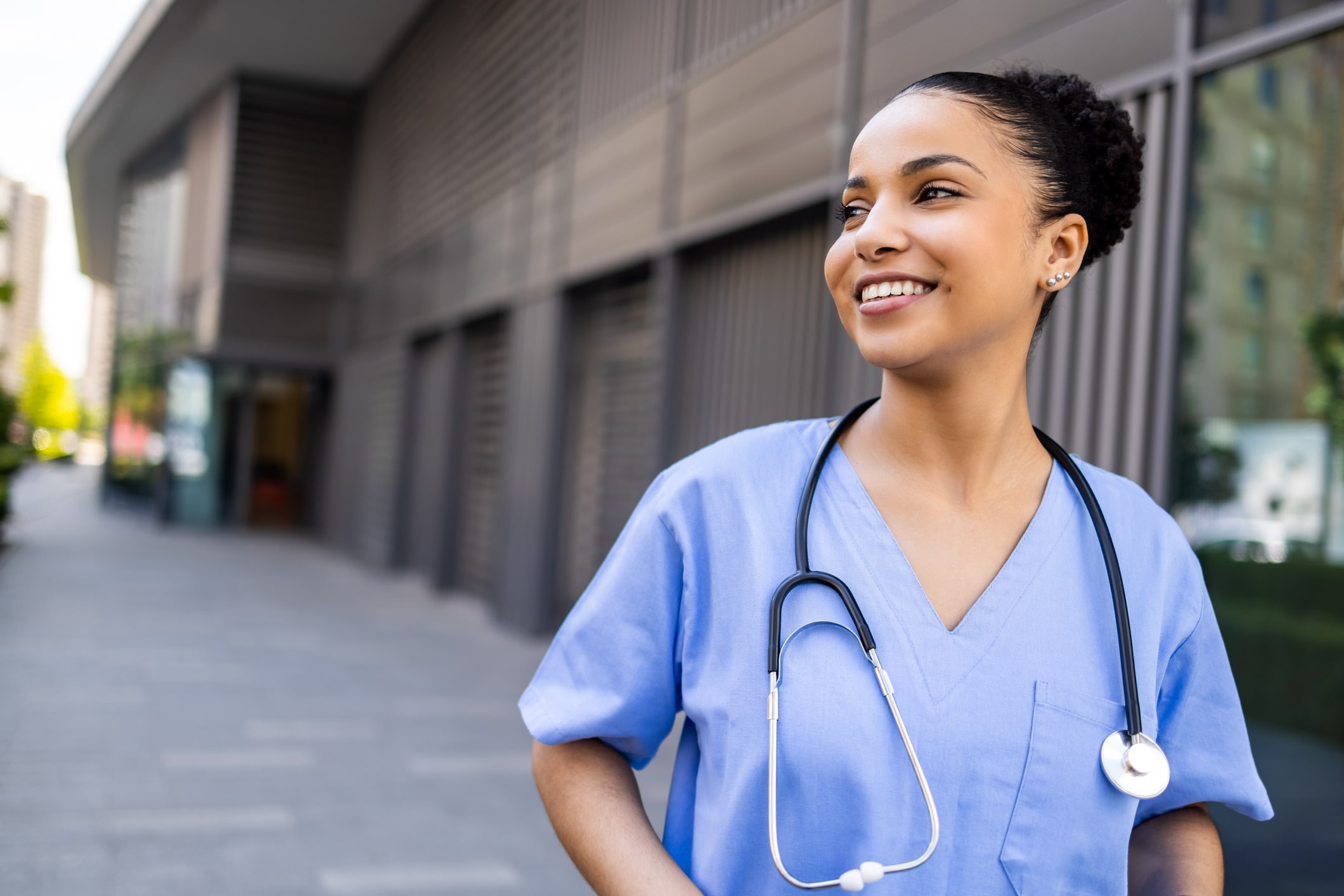 Nurse in scrubs outside 