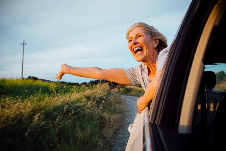 Travel nurse hanging out window in route to assignment Travel nurse hanging out window in route to assignment
