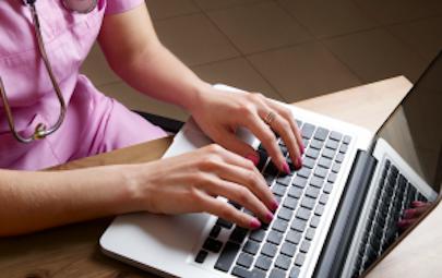 travel nurse typing on the computer travel nurse typing on the computer
