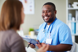 nurse smiling at patient nurse smiling at patient