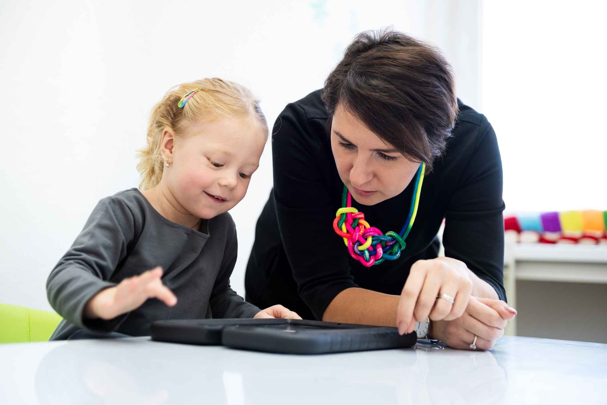 Occupational therapist helping a student.