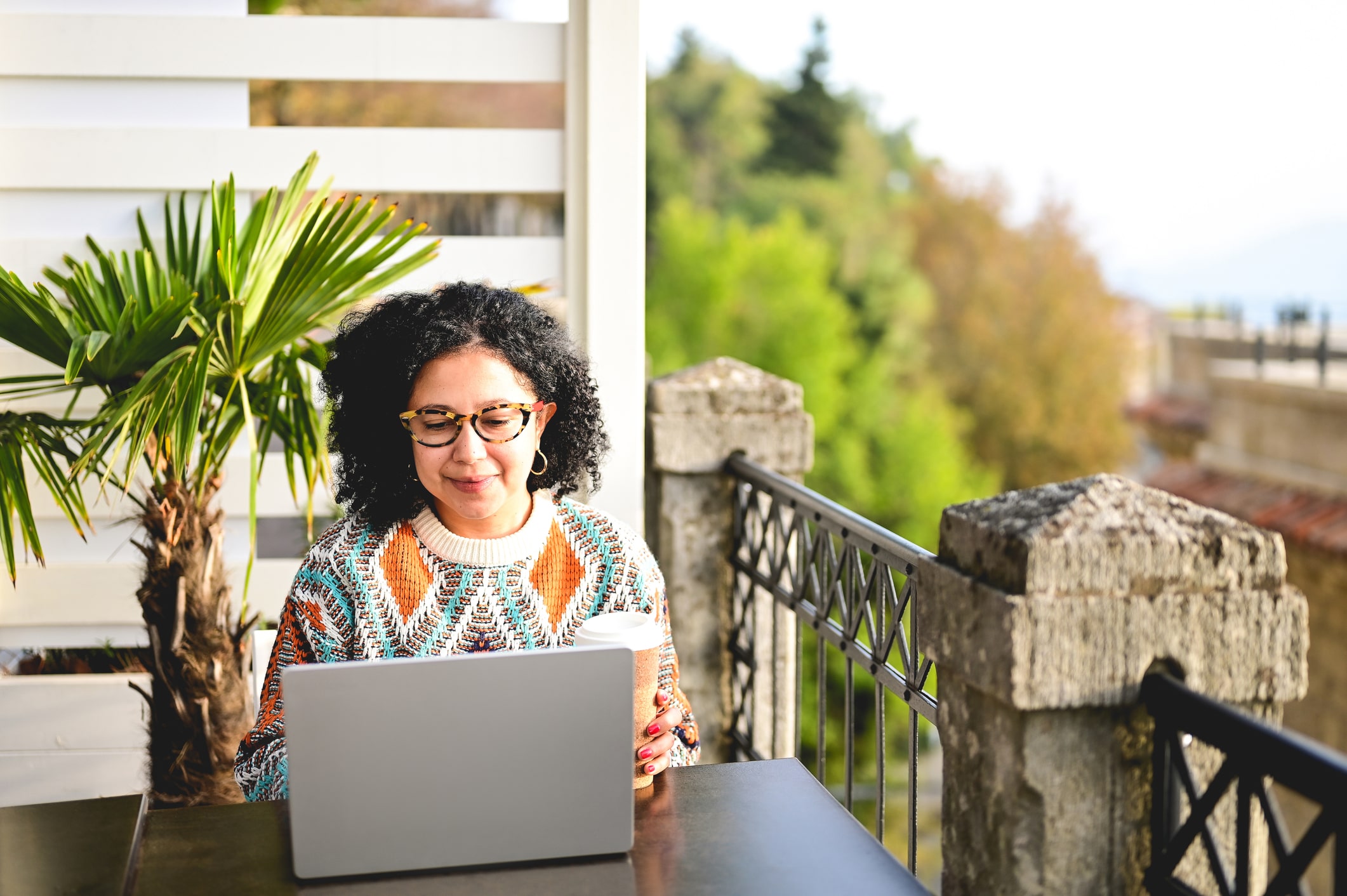 woman on laptop outside woman on laptop outside