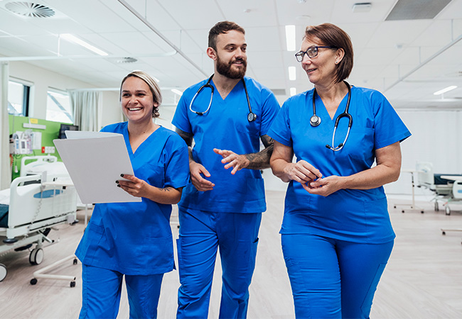 Three nurses talking to each other Three nurses talking to each other