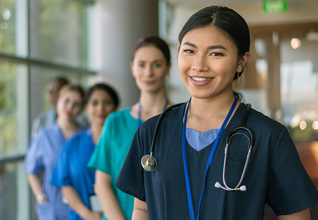 Female nurses standing together Female nurses standing together