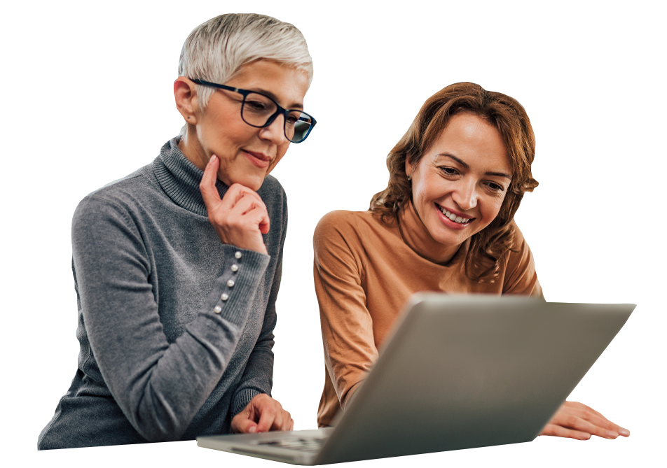 Two women looking at a laptop screen Two women looking at a laptop screen