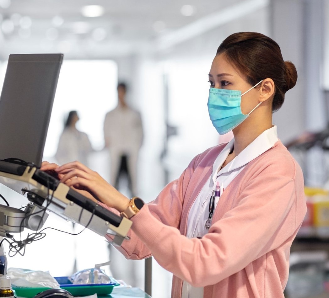 healthcare worker on computer healthcare worker on computer